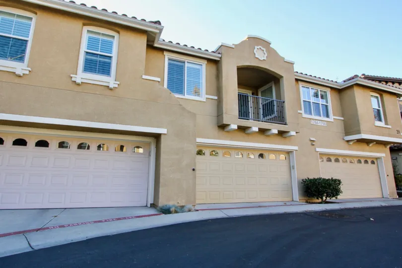 Morgans Corner beige two-story apartment condos with garage San Marcos California
