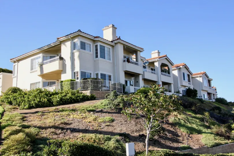A hilly view of a two-storey townhouse in the Panorama community.