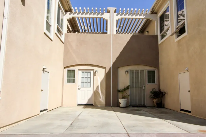 Richland Villas beige building with security doors San Marcos California