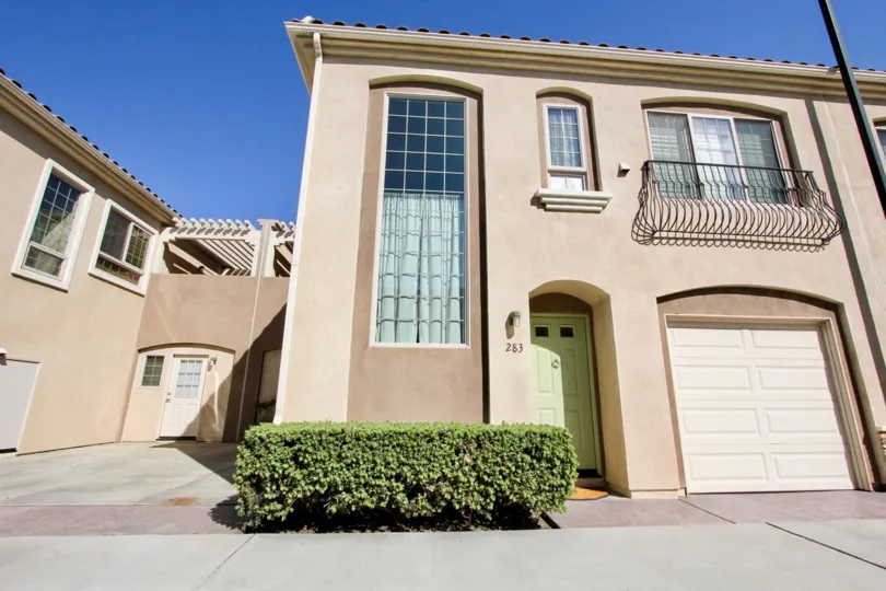 A sunny day in the area of Richland Villas, outside, condos, windows, balconies, tree