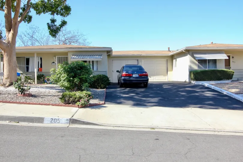 A car is parking in front the villa in the San Macros Manor in the state Califronia
