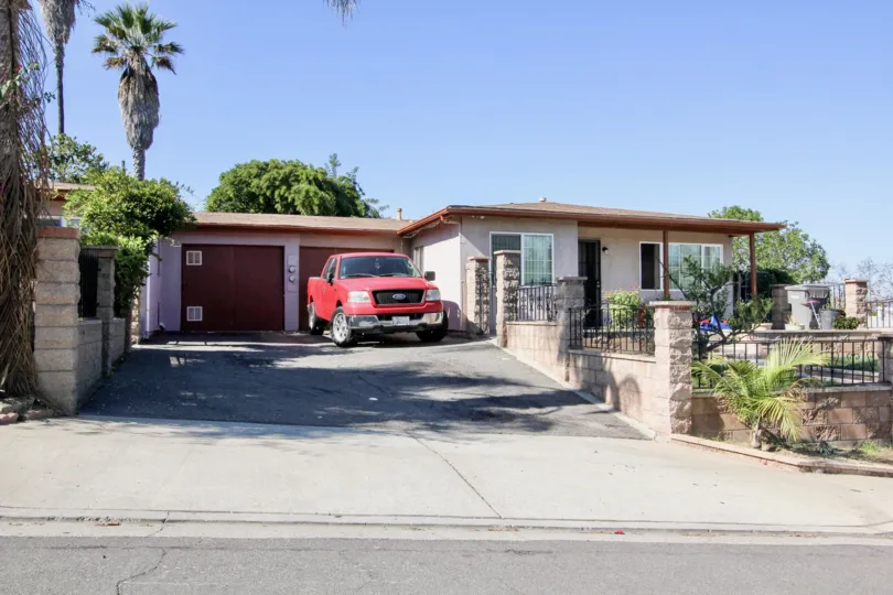 Front entrace and garage view of San Marcos Manor community, CA