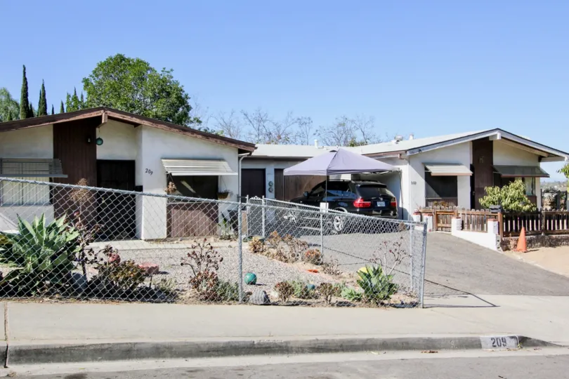 Driveway with fence and car in San Marcos Manor community in San Marcos, CA
