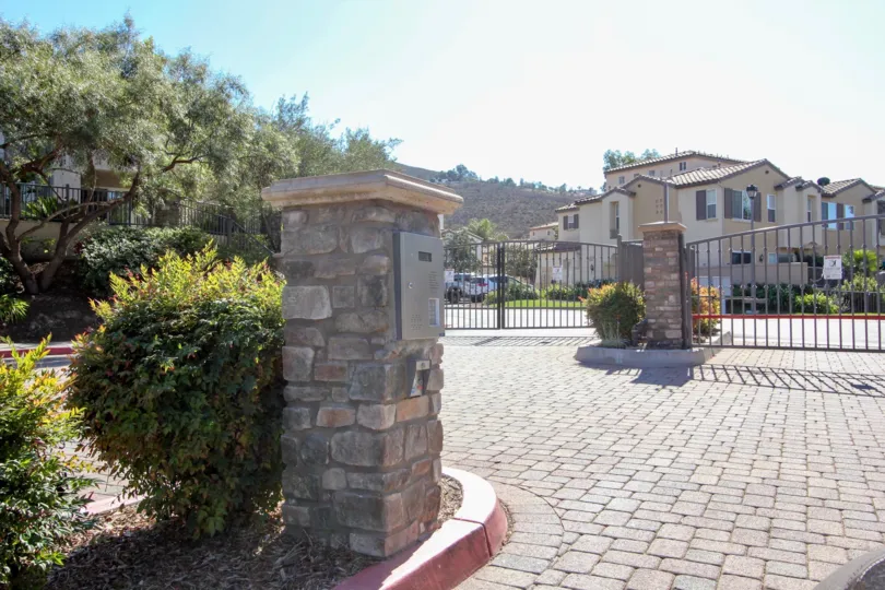 a house pathway and door in front and other houses similar and in back view