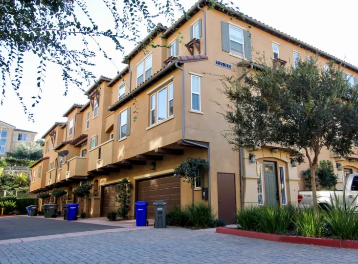 A sunny day in the area of Soltaire, outside, condos, palm trees, steet