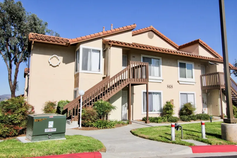 Brown railing leading to residence in Sommerset By The Lake in San Marcos CA