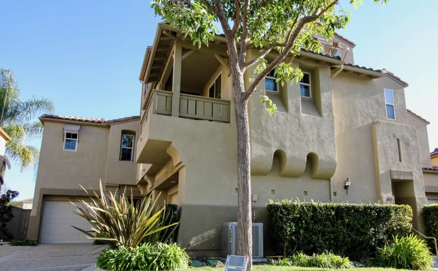 Three story home with a very tall tree at Springfield in San Marcos CA
