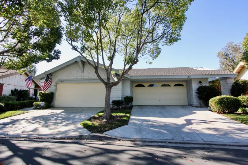 Two garages surrounded by large trees inside Sunrise Pointe in San Marcos CA