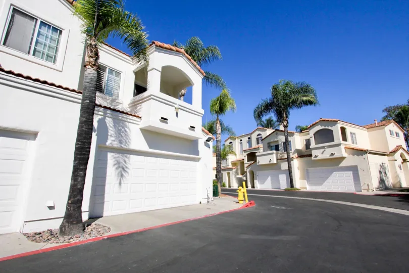Driveway near white residences inside the Villa Aspara in San Marcos CA