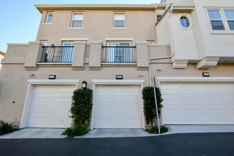 Garage under a balcony for sit outs sliding windows of Village Square.