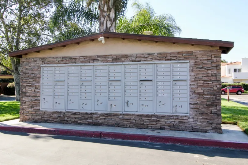 Huge mailbox structure with silver mail boxes in Westlake Ranch at San Marcos CA