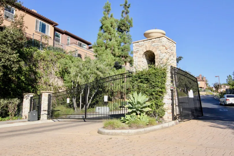 A sunny day in the Westridge with gates and trees.