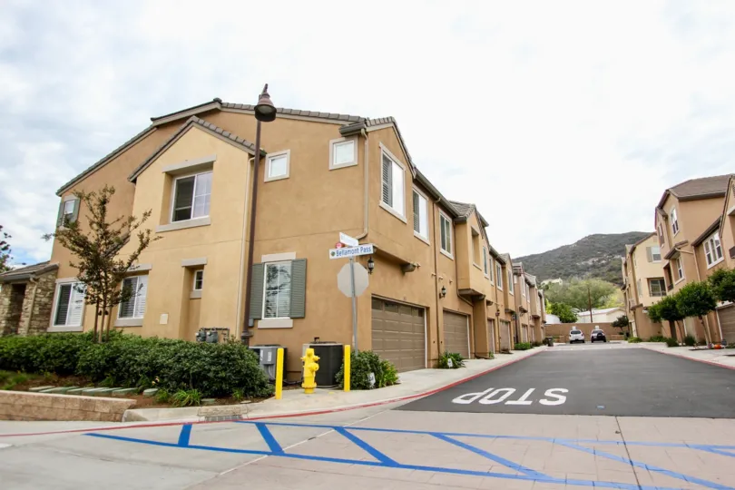 A street way corner with mountain in background in Aubrey Glen
