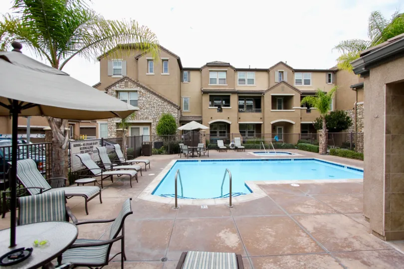 Aubrey Glen community Santee California pool lounge chairs umbrella table arched entry windows