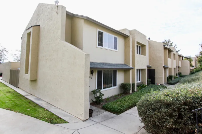 Green, vibrant, and private front entryway in the Corsican Villas community of Santee, California
