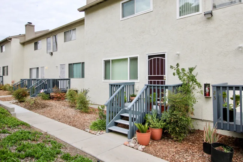 A sunny day in the area of Fanita Rancho, potted plants, stairs, doors, windows, grass