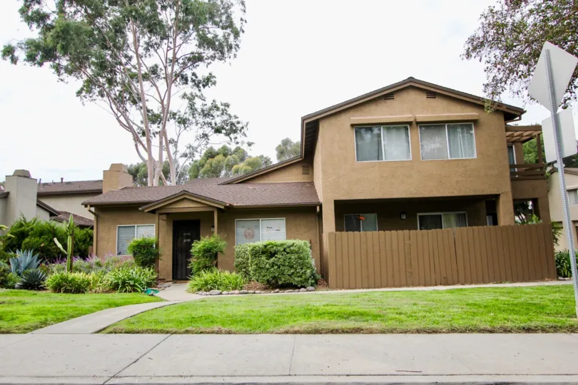 A brown 2-story residental house in the Highland Trails Community. Santee, California.