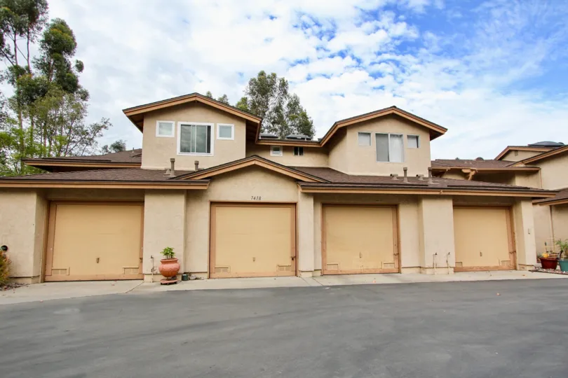 Beautiful home with four car garage in the Highland Trails are of Santee California in a natural setting.
