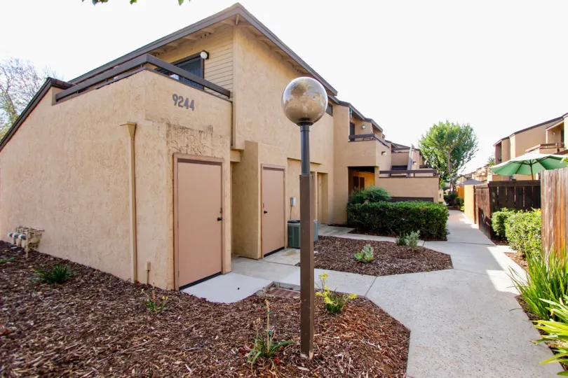 A sunny day in the area of Lakeview Carlton Hills, condos, light post, door