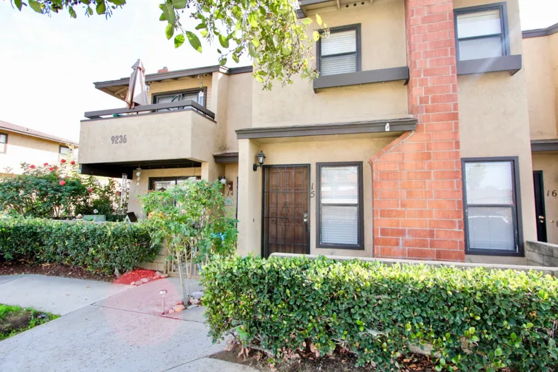 Image of a multi-family stucco dwelling: Lakeview Carlton Hills community in Santee, California.