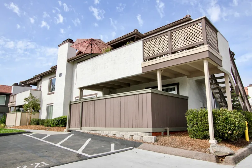 A sunny day in the area of Riderwood Gardens, Condo, tree, window, fence, parking lot