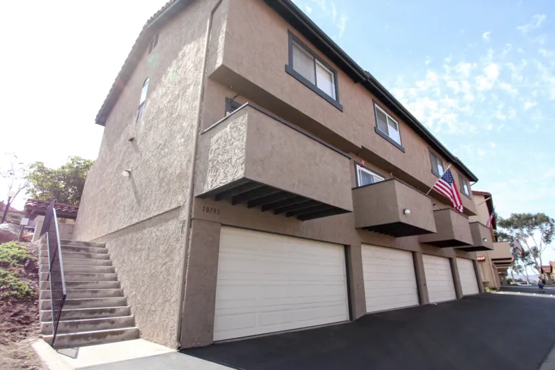 Three story housing with patios and garages at Riderwood Terrace in Santee CA