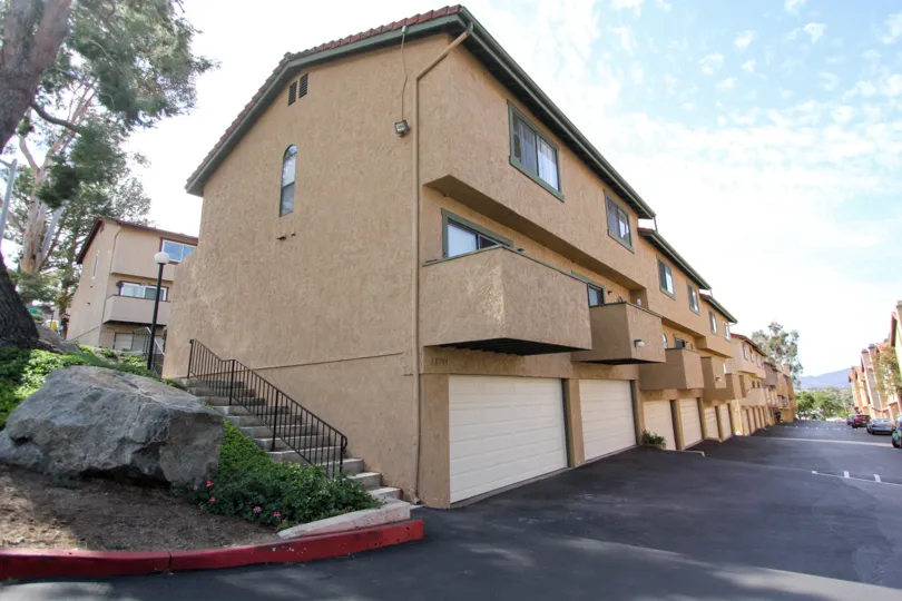 Private balconies and tuck-under garages at Riderwood Terrace in Santee, California.