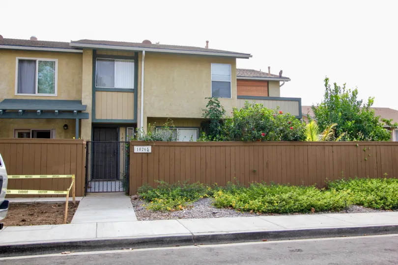 iderwood Village  ,: Santee  , California,brown building, plants