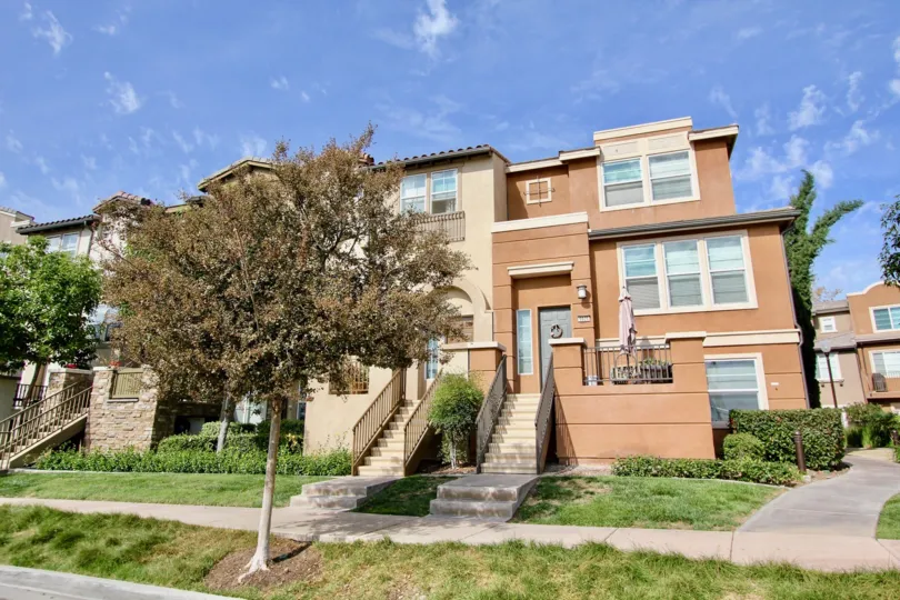 A sunny day in the area of Rio Terrace, condos, tree, stairway, door