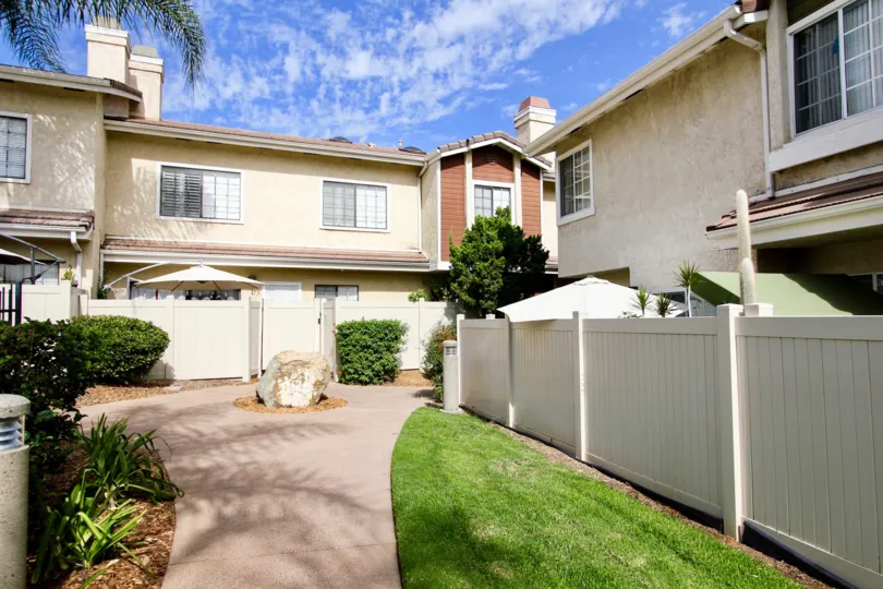 Palm trees and blue skies at the Lakes with private fenced patios in Santee, California