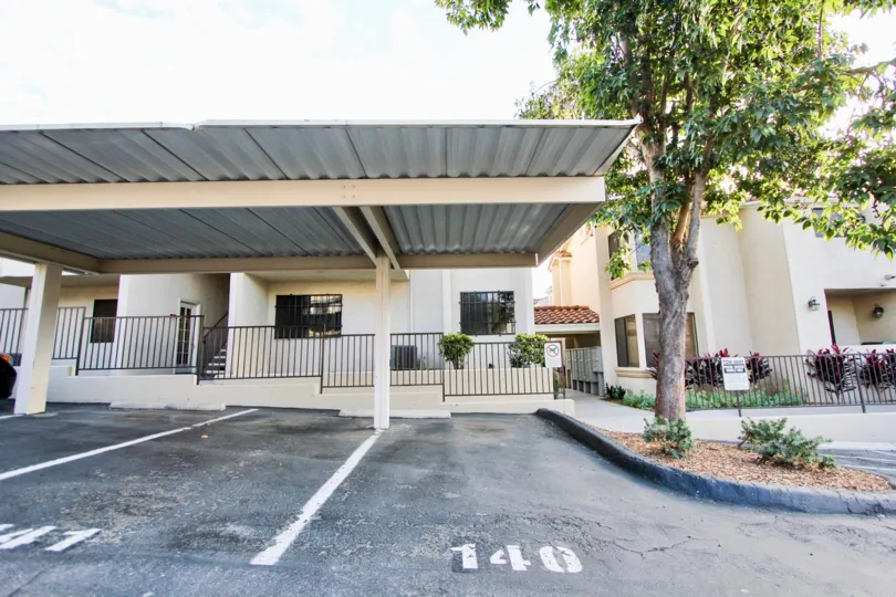 A sunny day in the area of Towne Villas, parking area,