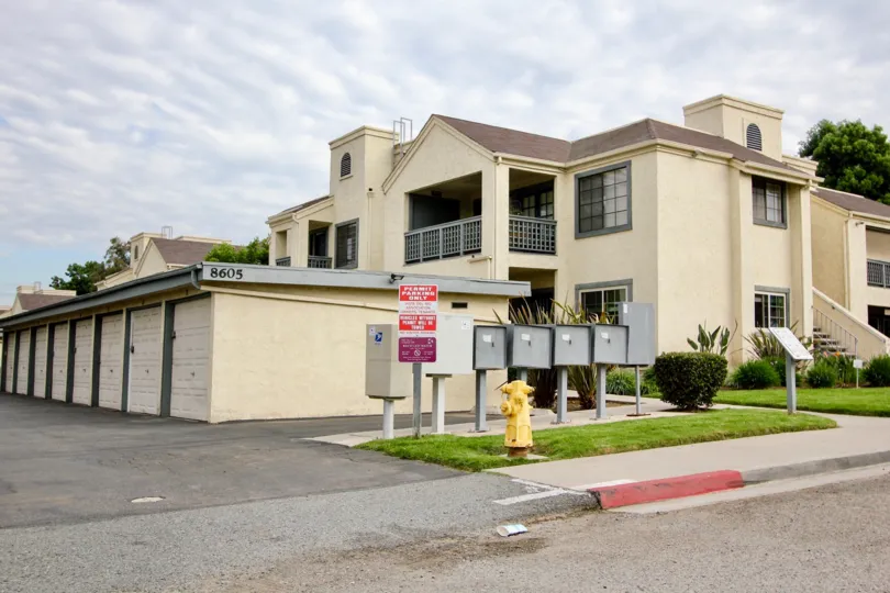 A two level apartment building with attached garages and 2nd floor balconies in Vista Del Rio, Santee California.