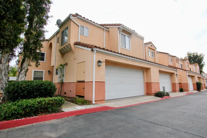 A sunny day in the area of Vista Del Verde, garage, driveway, bushes, tree, garage