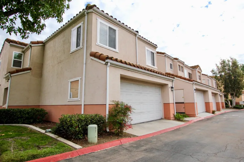 Several adobe town homes in Vista Del Verde with drive in garages