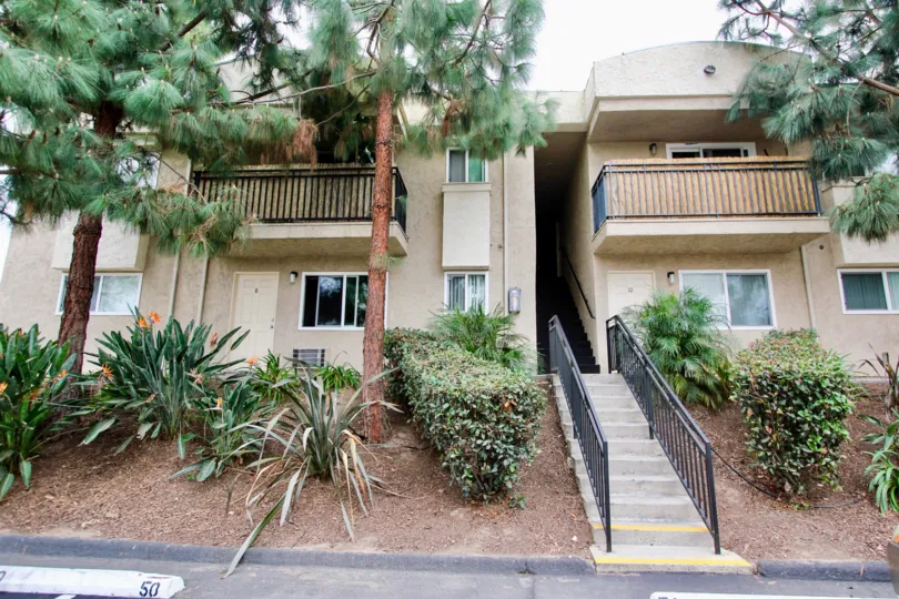 Helix De Oro beige two-story with stairwell and landscaping Spring Valley California