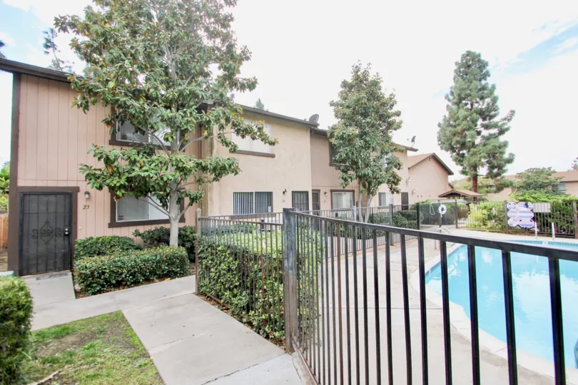 Parque Gillespie gated pool and beige two-story Spring Valley California