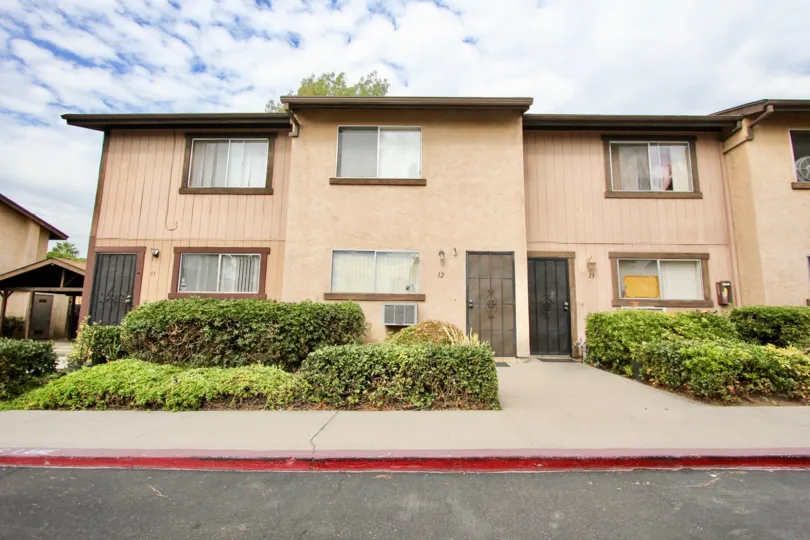 Multiple homes in the living divisions of Parque Gillespie with the window open in Spring Valley, California