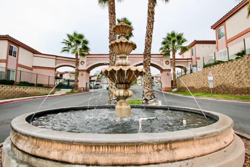A beautiful day in Pointe Lakeview with a small water fall.