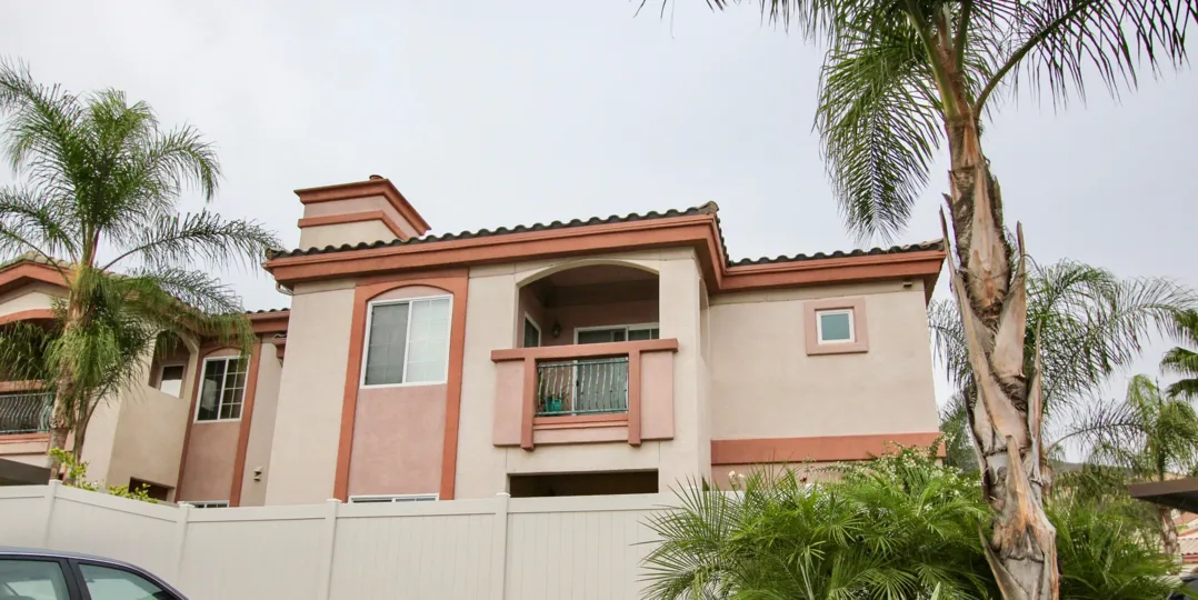 A two-storey residence with orange trimmings in Pointe Lakeview neighborhood.