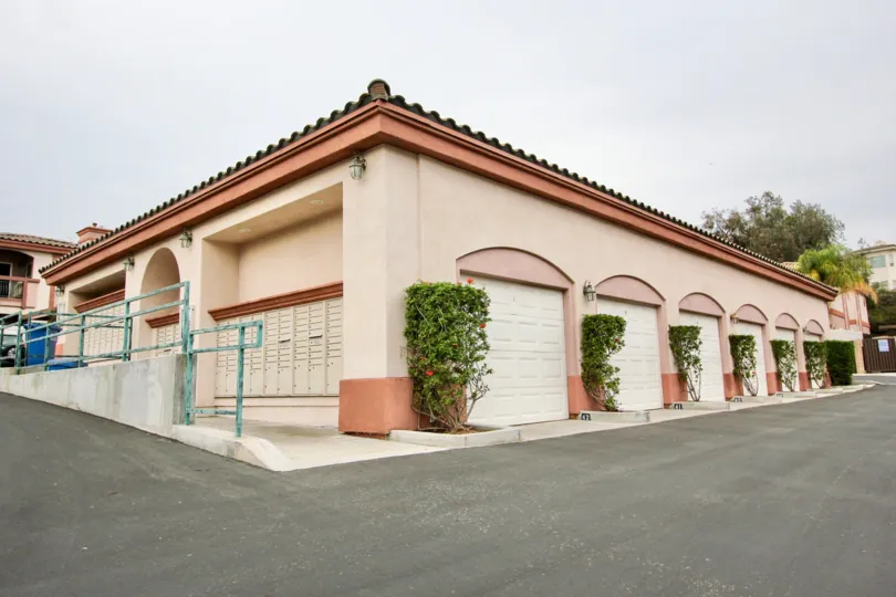 A view of the parking garages and mailbox area in Pointe Lakeview of Spring Valley, California