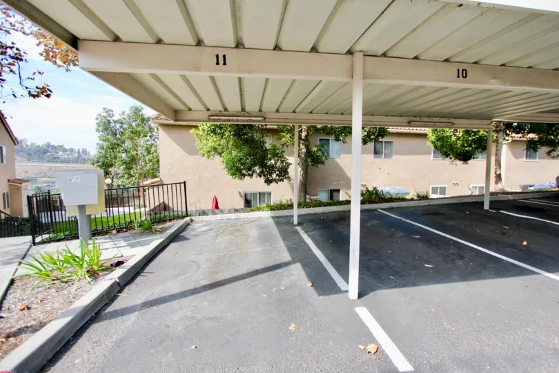 Covered parking spots and a sunny sky in the Quarry Palms Community in Spring Valley, CA.