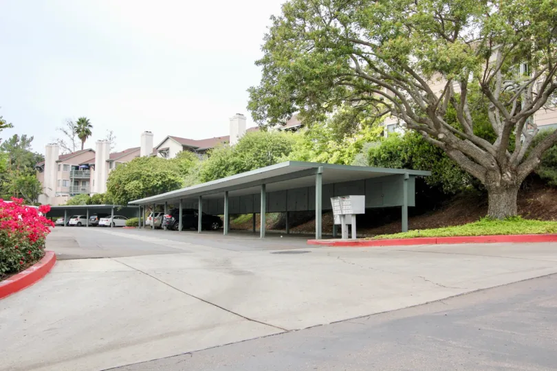 View of entrace, covered parking structure and mailboxes