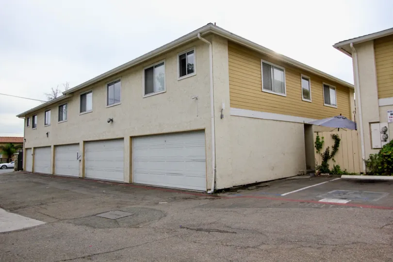 A two-storey rental with ground level parking in the Sandstone neighborhood.
