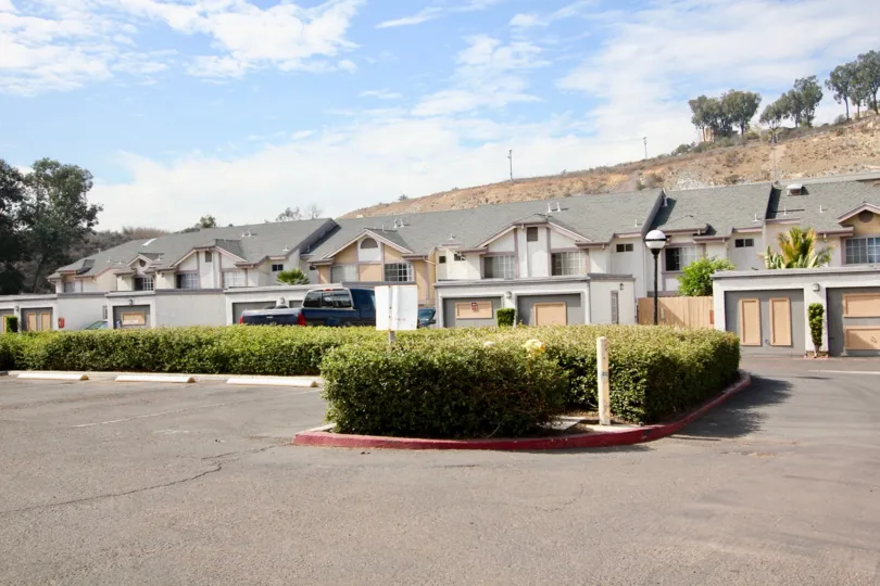 THE BUNGALOW IN THE SPRING CANYON WITH THE CAR PARKING, PLANTS, TREES, LIGHT