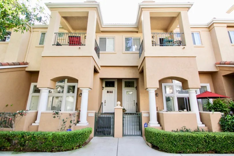 A front view of a tan building in the Capri complex in University City CA