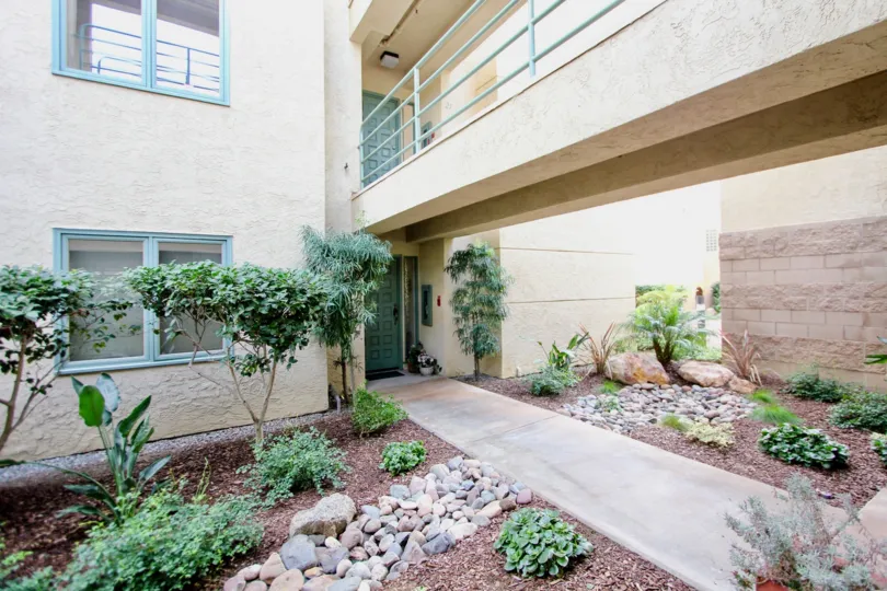 THE APARTMENT IN THE LA JOLLA CITY CLUB WITH THE PLANTS, ROCK, STONES.