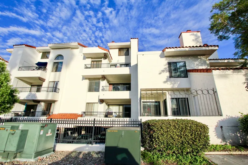Three story housing with iron fence at La Jolla Garden Villas in University City California