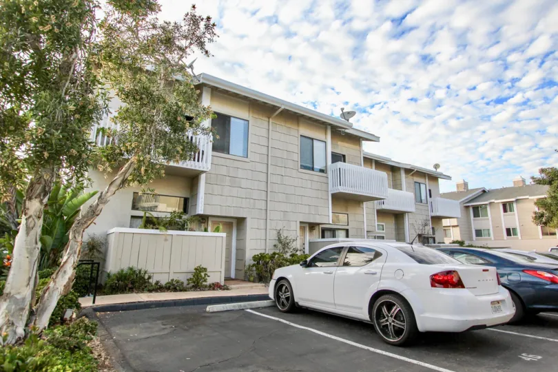 A sunny day in the La Jolla Village Park with car parking facilty and tree
