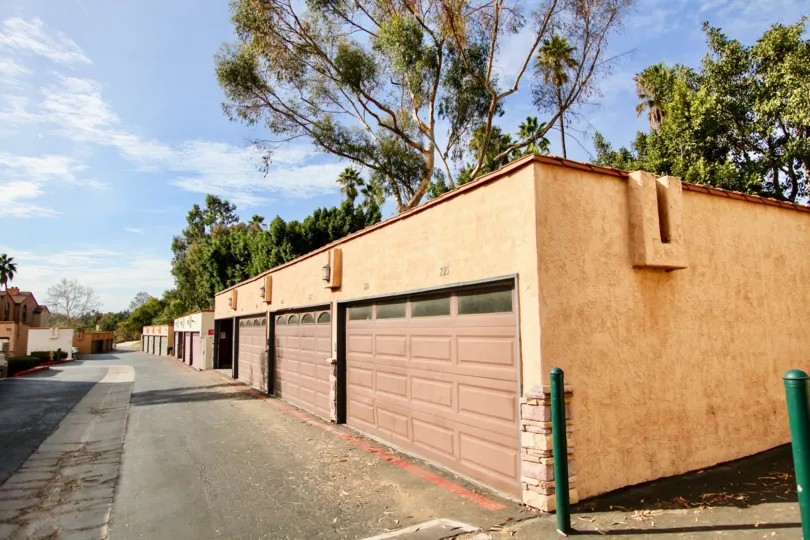 Double car attached garages with large mature trees and a wide backlane in Lucera