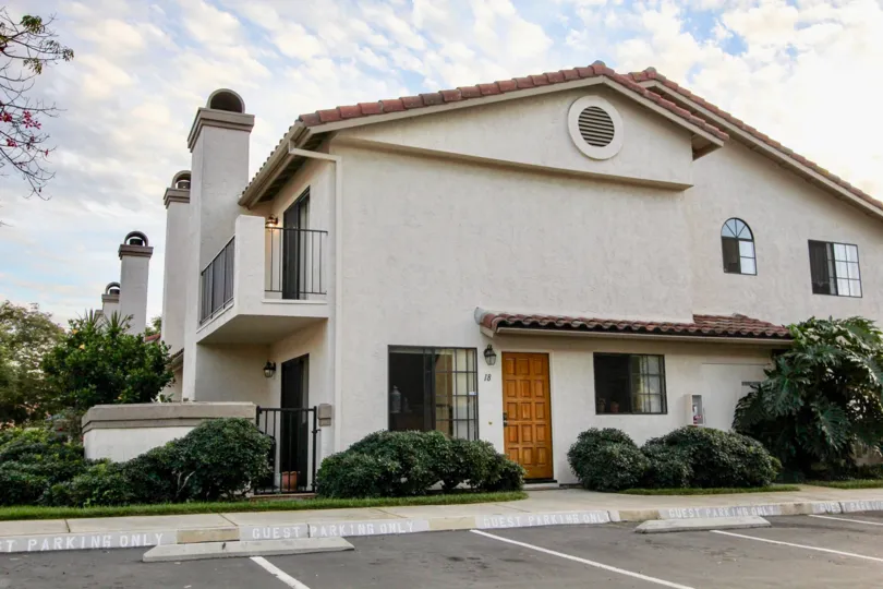 A two story Hispanic inspired home with landscaping at Marbella